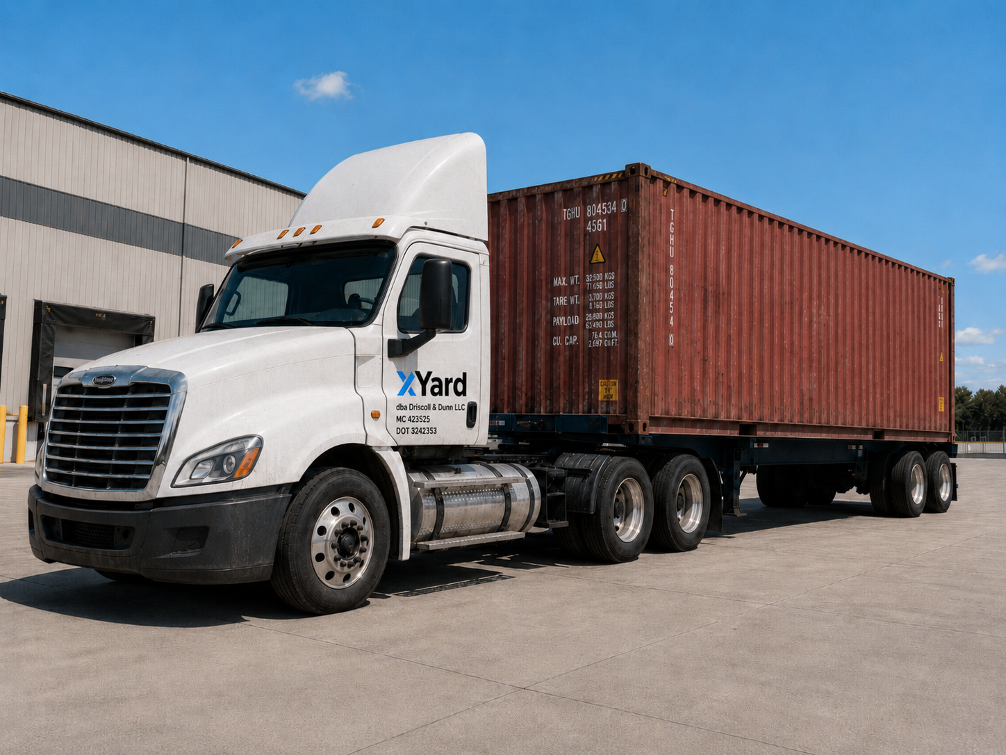 xYard branded semi truck hauling an intermodal container at a warehouse facility
